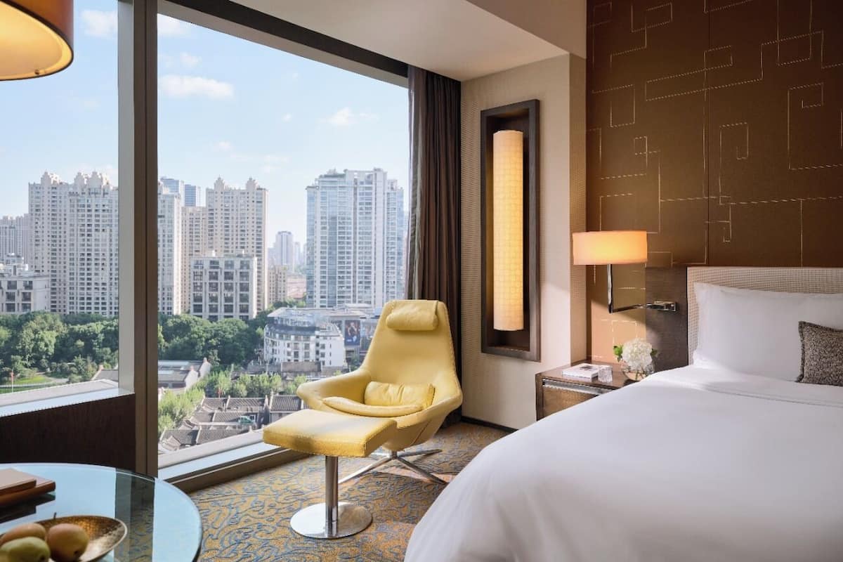 Premier Xintiandi View King Room | Premium bedding, down comforters, in-room safe, individually decorated