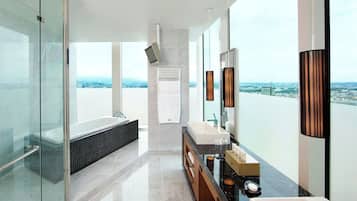 Executive Suite, 1 King Bed, Corner | Bathroom | Separate tub and shower, free toiletries, hair dryer, bathrobes