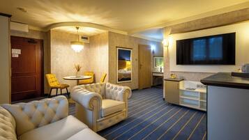 Standard Suite, 1 King Bed | Living room | LCD TV