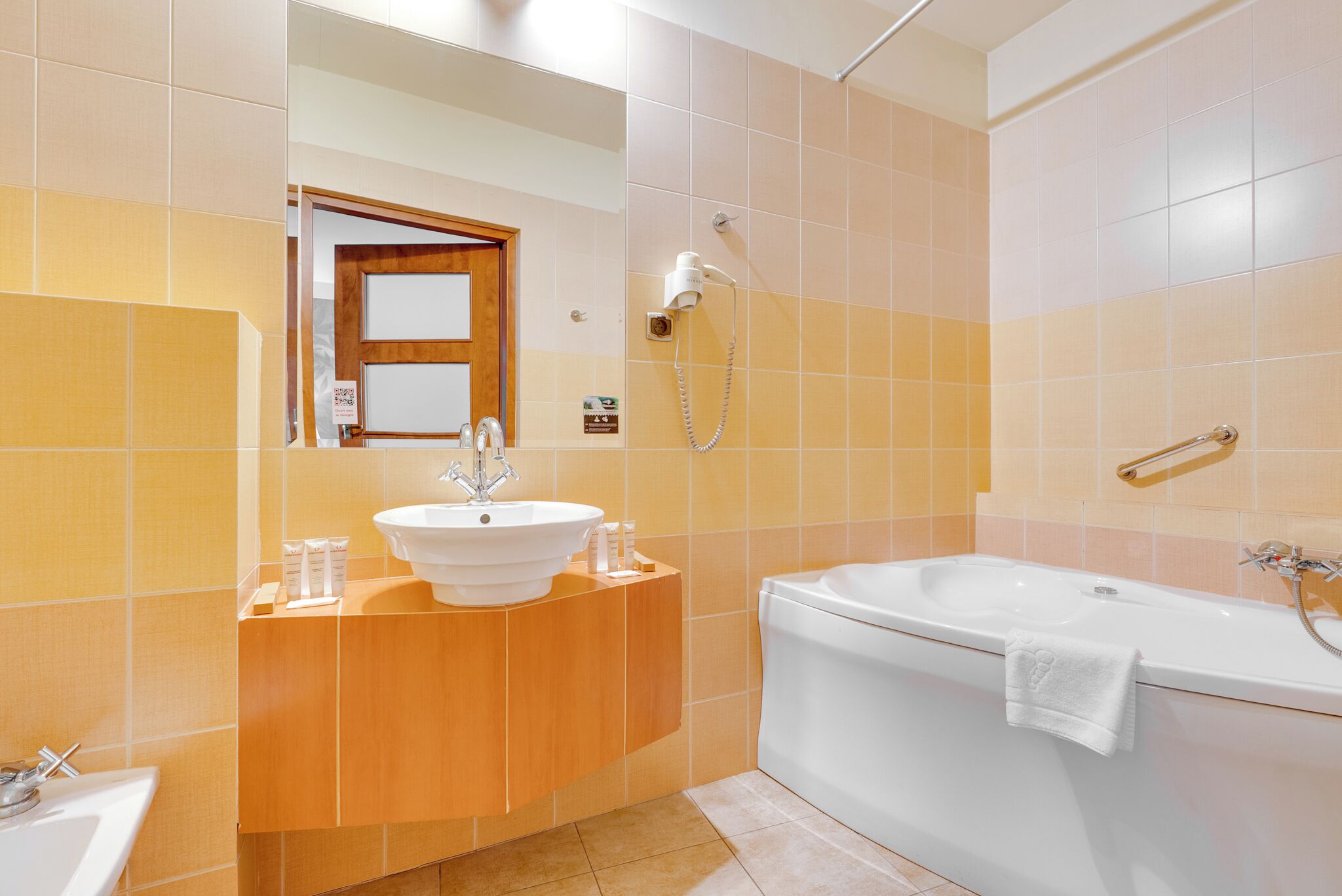standard suite, 1 king bed | bathroom | free toiletries, hair dryer, slippers, towels