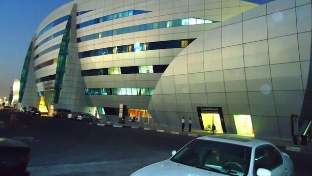 A modern building with a curved facade and large windows. - Al Jazira Club Hotel (Abu Dhabi)