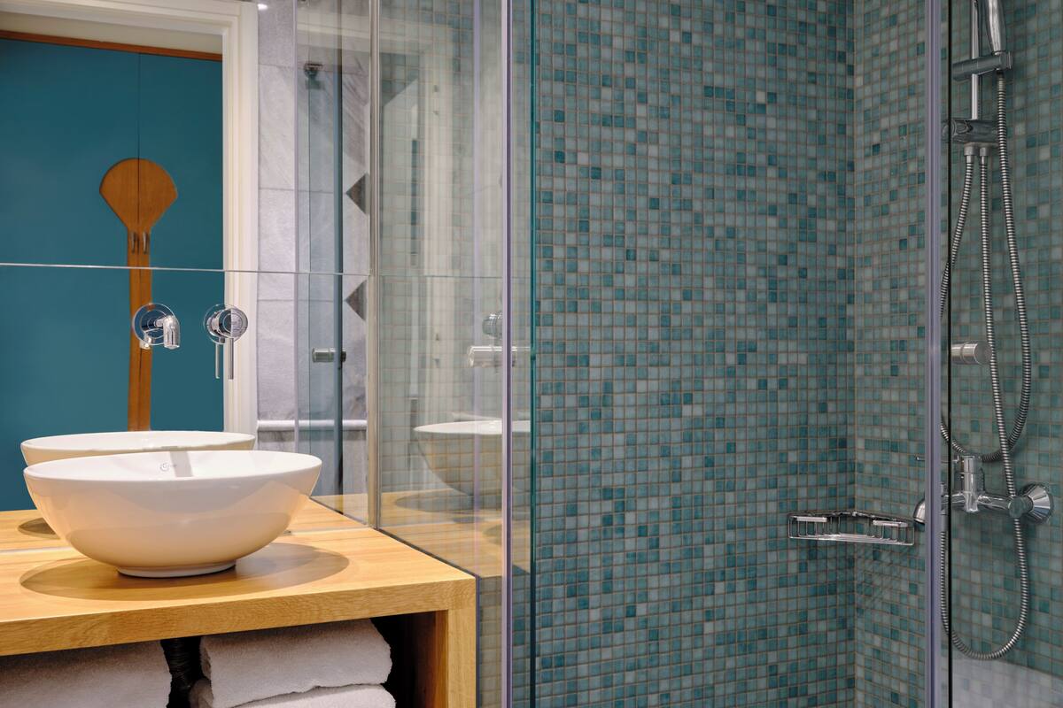 shower, rainfall showerhead, designer toiletries, hair dryer