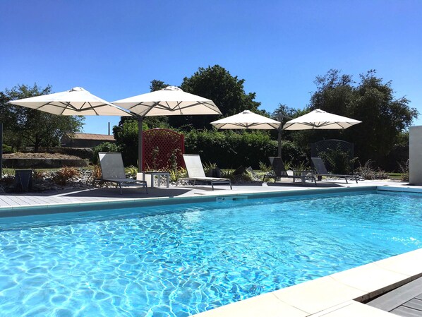 Outdoor pool, open 9:00 AM to 8:00 PM, pool loungers