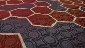 A hotel room with a patterned carpet, a bed with white linens, and a lamp on a bedside table. - Ashford Motel (Ashford)