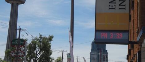A hotel sign for Empress Inn & Suites with a digital clock displaying 3:39 PM.