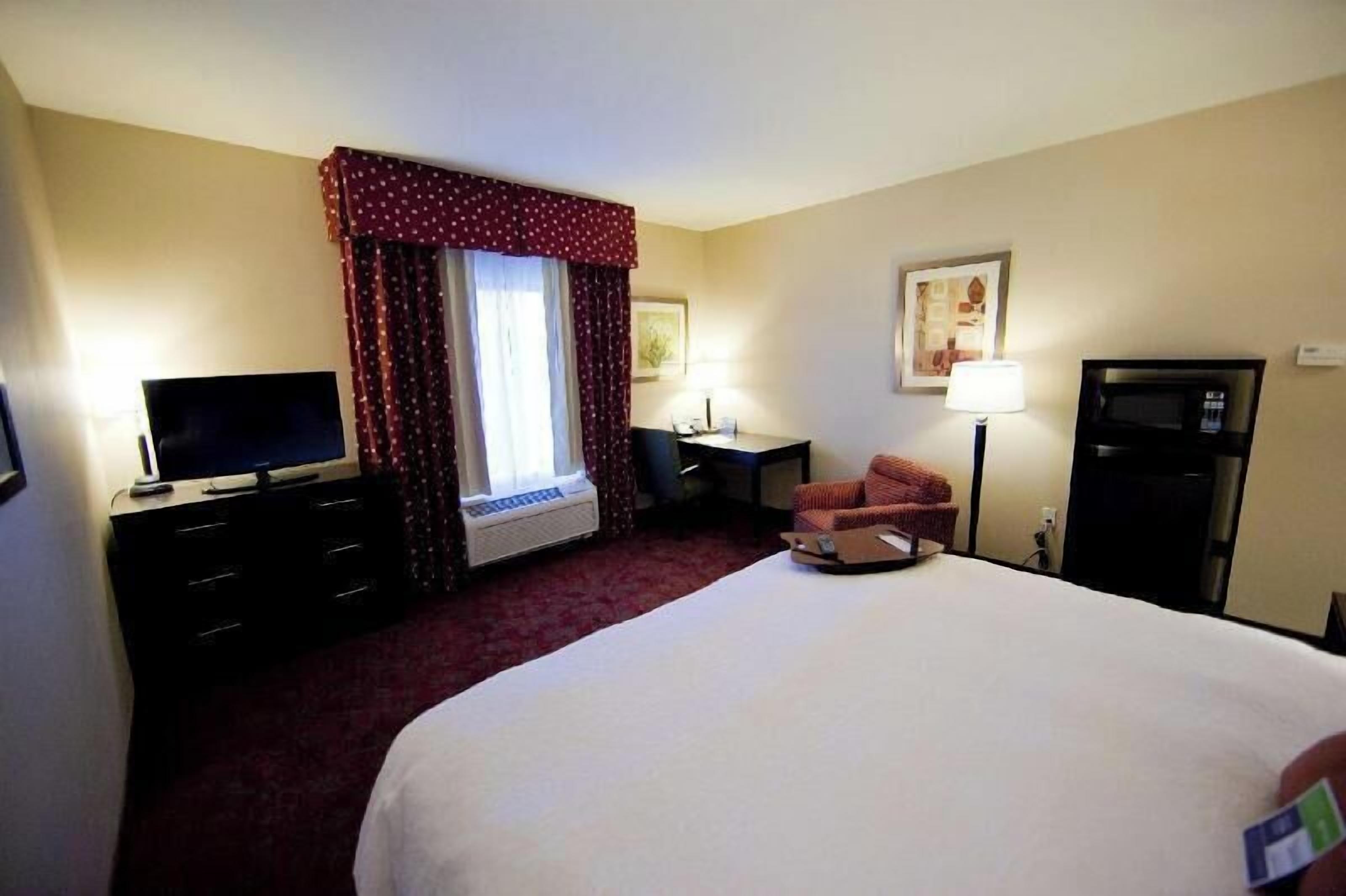 Premium bedding, laptop workspace, blackout drapes, iron/ironing board