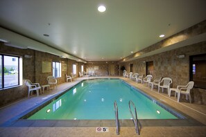 Relax by the pool, surrounded by a spacious deck and comfortable seating.