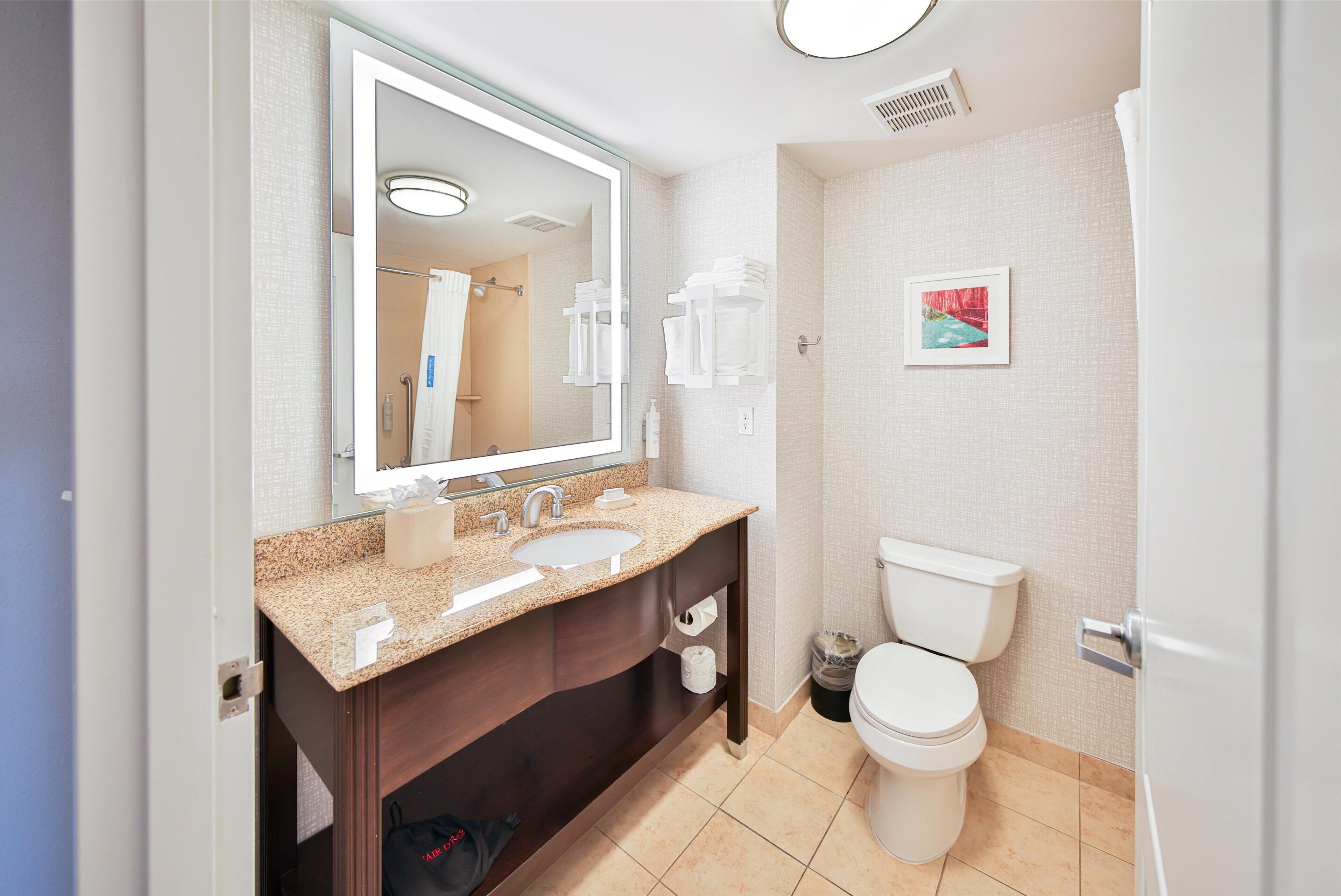 two queen beds, non-smoking | bathroom | hair dryer, towels, soap, shampoo