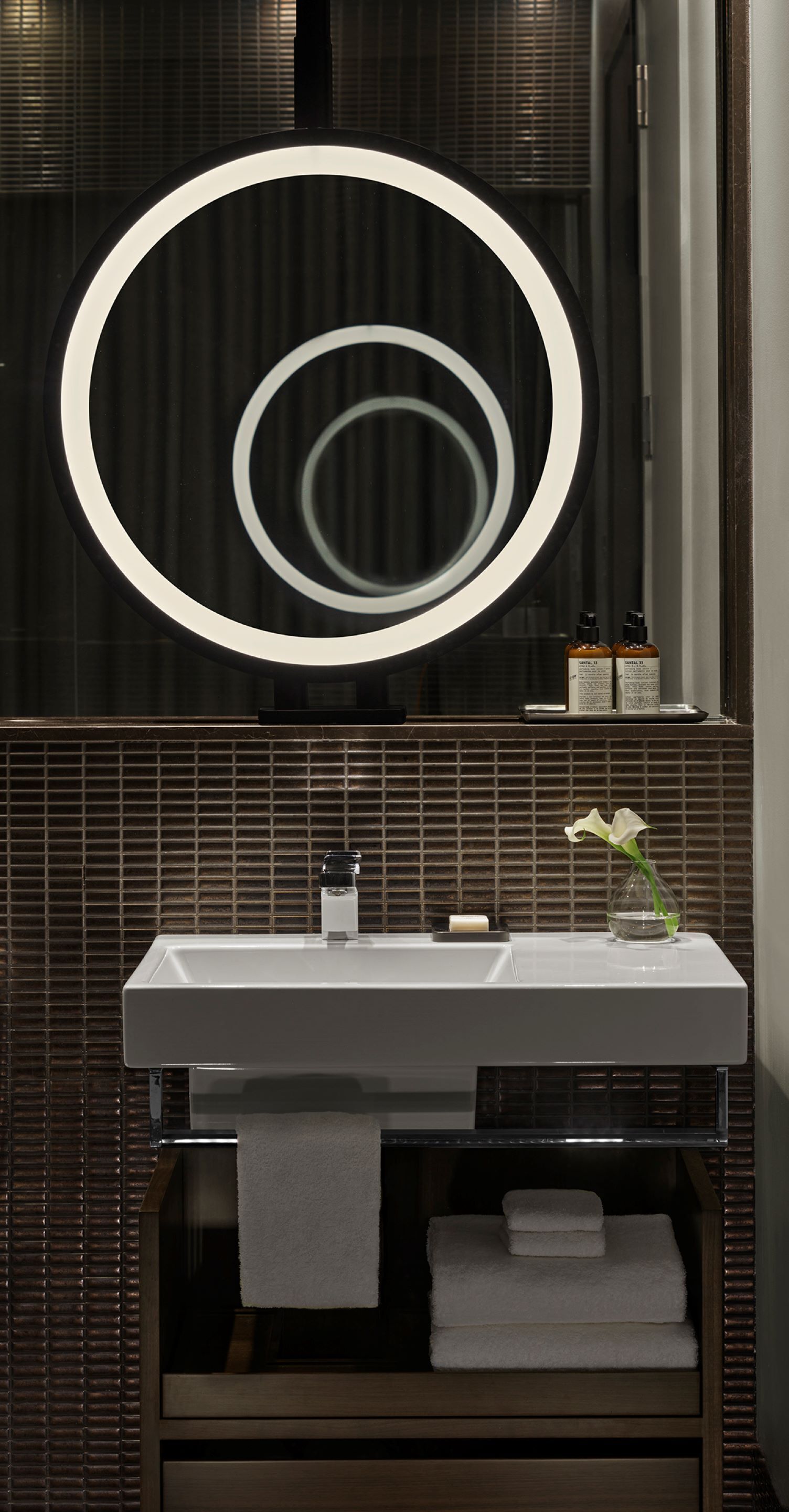 designer toiletries, hair dryer, bathrobes, slippers