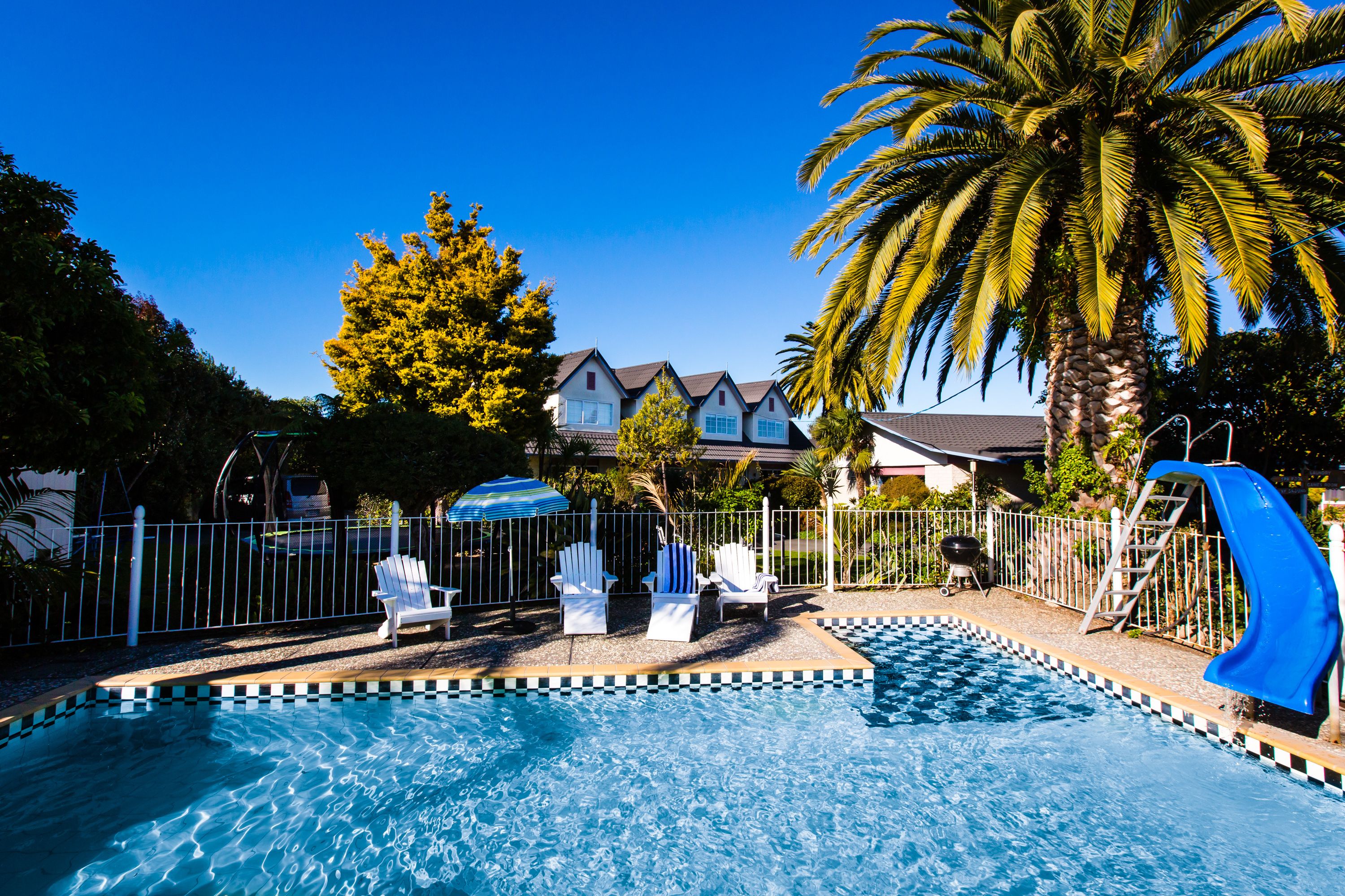 Seasonal outdoor pool, open 8:30 AM to 8:30 PM, pool umbrellas