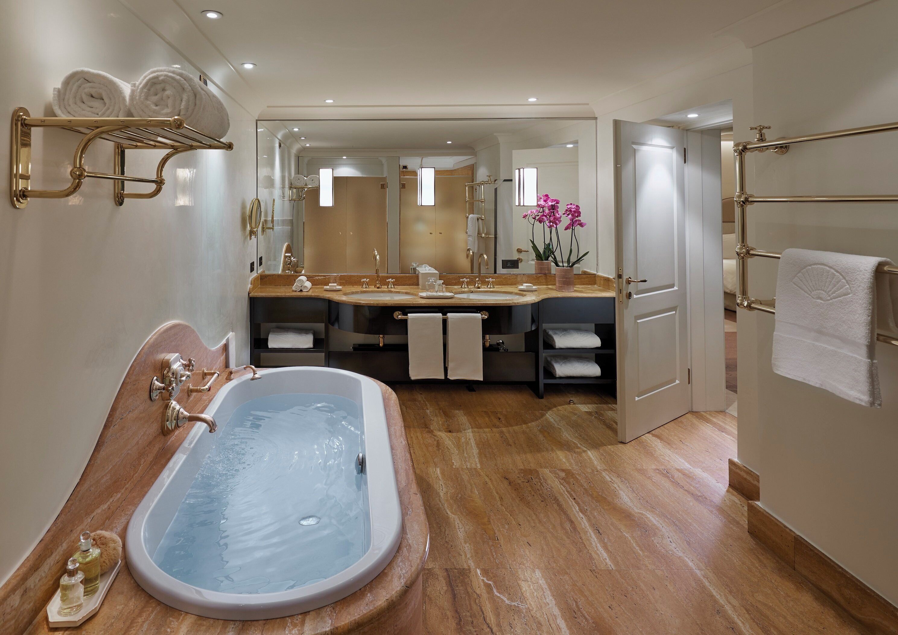 combined shower/bathtub, designer toiletries, hair dryer, bathrobes