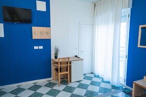 Quadruple Room | Minibar, in-room safe, desk, laptop workspace - Aldebaran (Rimini)
