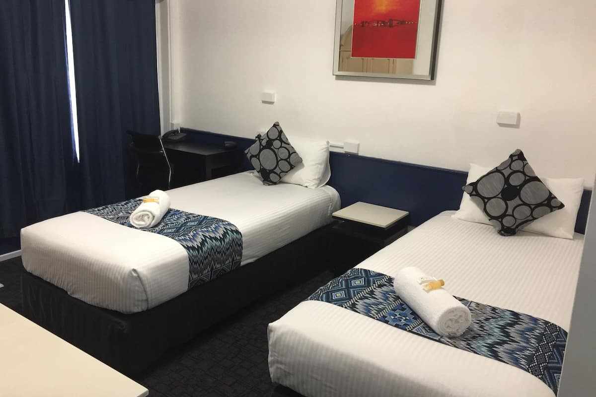 Classic Twin Room, Multiple Bedrooms, Non Smoking | Blackout drapes, iron/ironing board, free WiFi, bed sheets