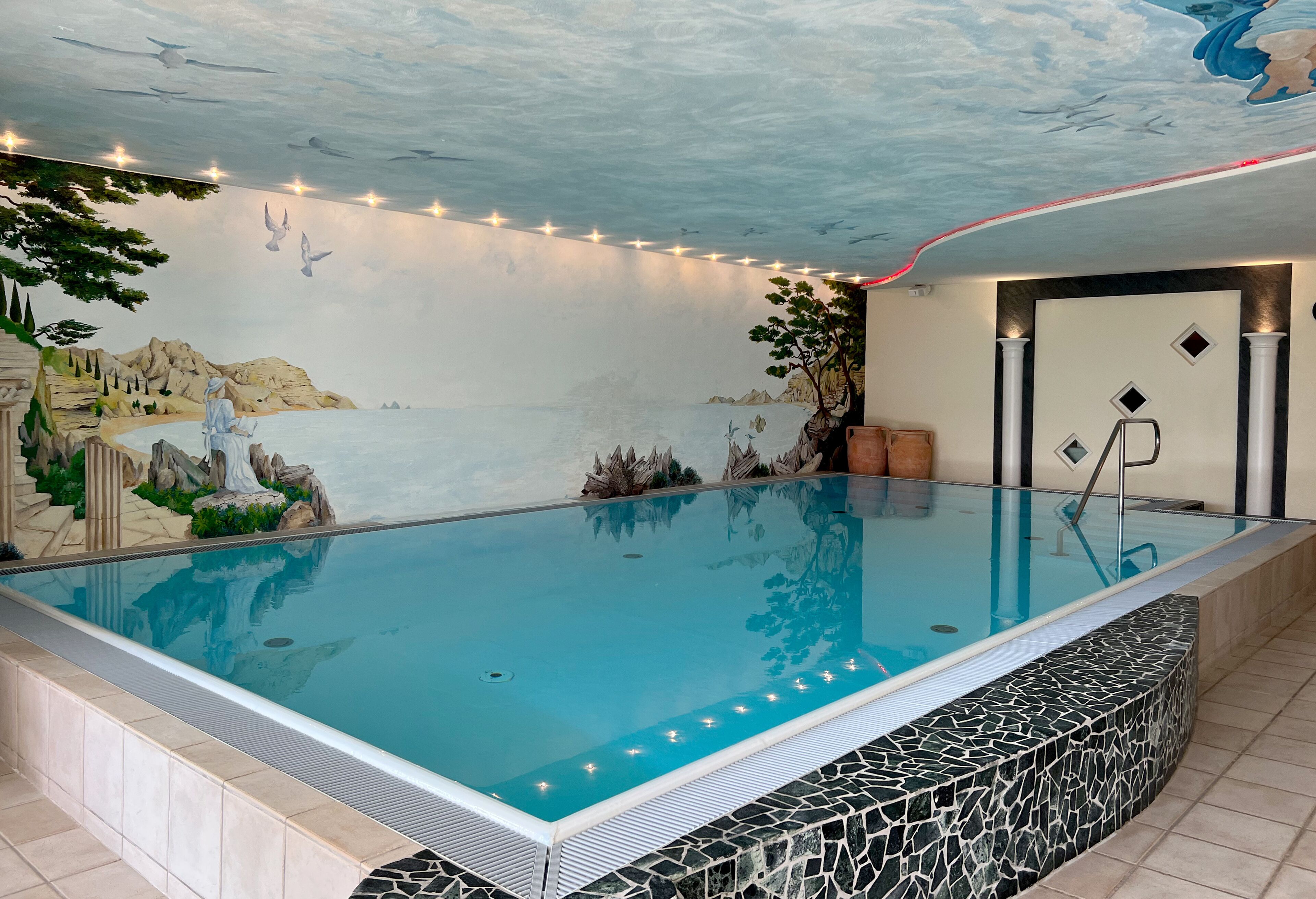 indoor pool, open 7:30 am to 7:00 pm, pool umbrellas, pool loungers