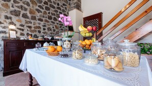 A breakfast buffet with various food items and decorative elements. - Bosco Ciancio (Biancavilla)