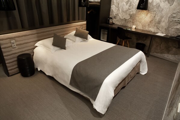 Pillow-top beds, free minibar, in-room safe, desk