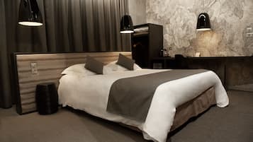 Colchones con acolchado adicional y minibar con artículos gratuitos