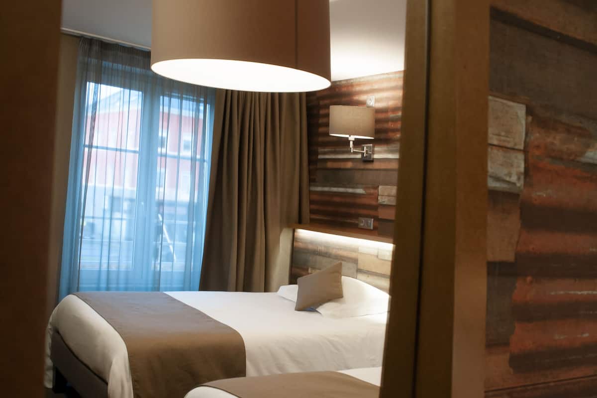 pillow-top beds, free minibar, in-room safe, desk