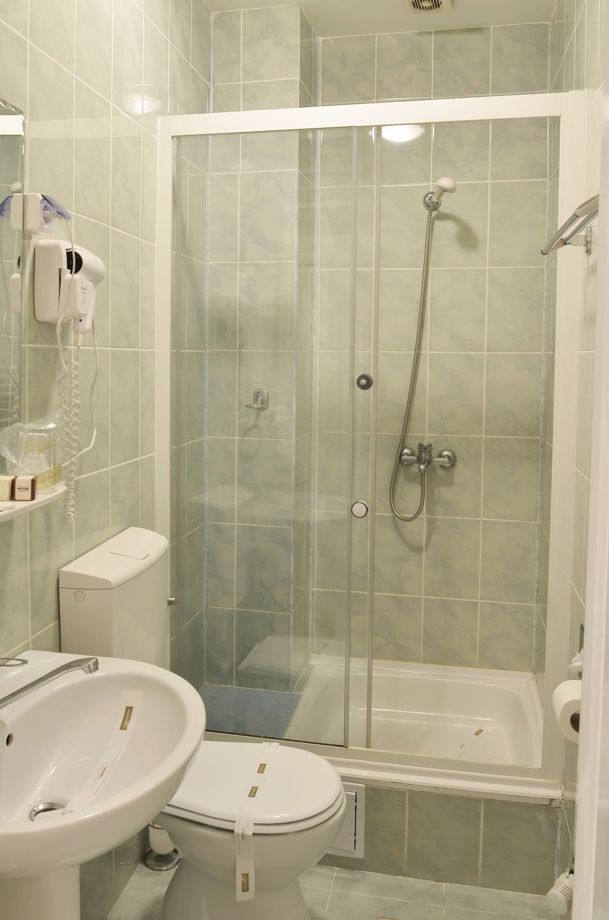 superior twin room | bathroom | hair dryer, towels, soap, shampoo