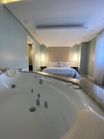 Executive Suite | Bathroom | Designer toiletries, hair dryer, bathrobes, slippers