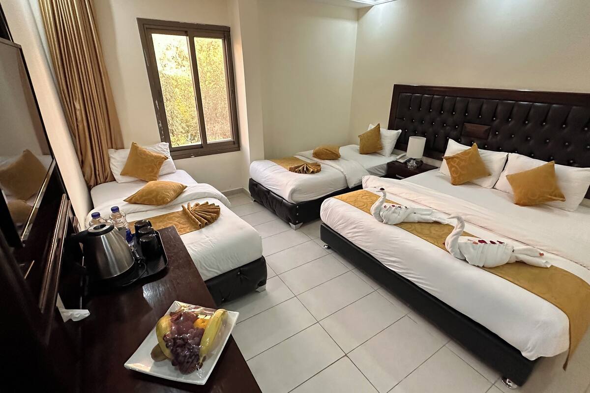 deluxe quadruple room, 1 bedroom | 1 bedroom, select comfort beds, minibar, in-room safe