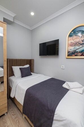 Deluxe Family Room | Sábanas de algodón egipcio y ropa de cama de alta calidad 