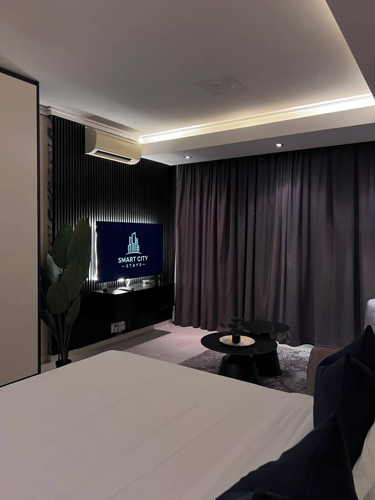 Executive Studio Apartment | Living area | TV