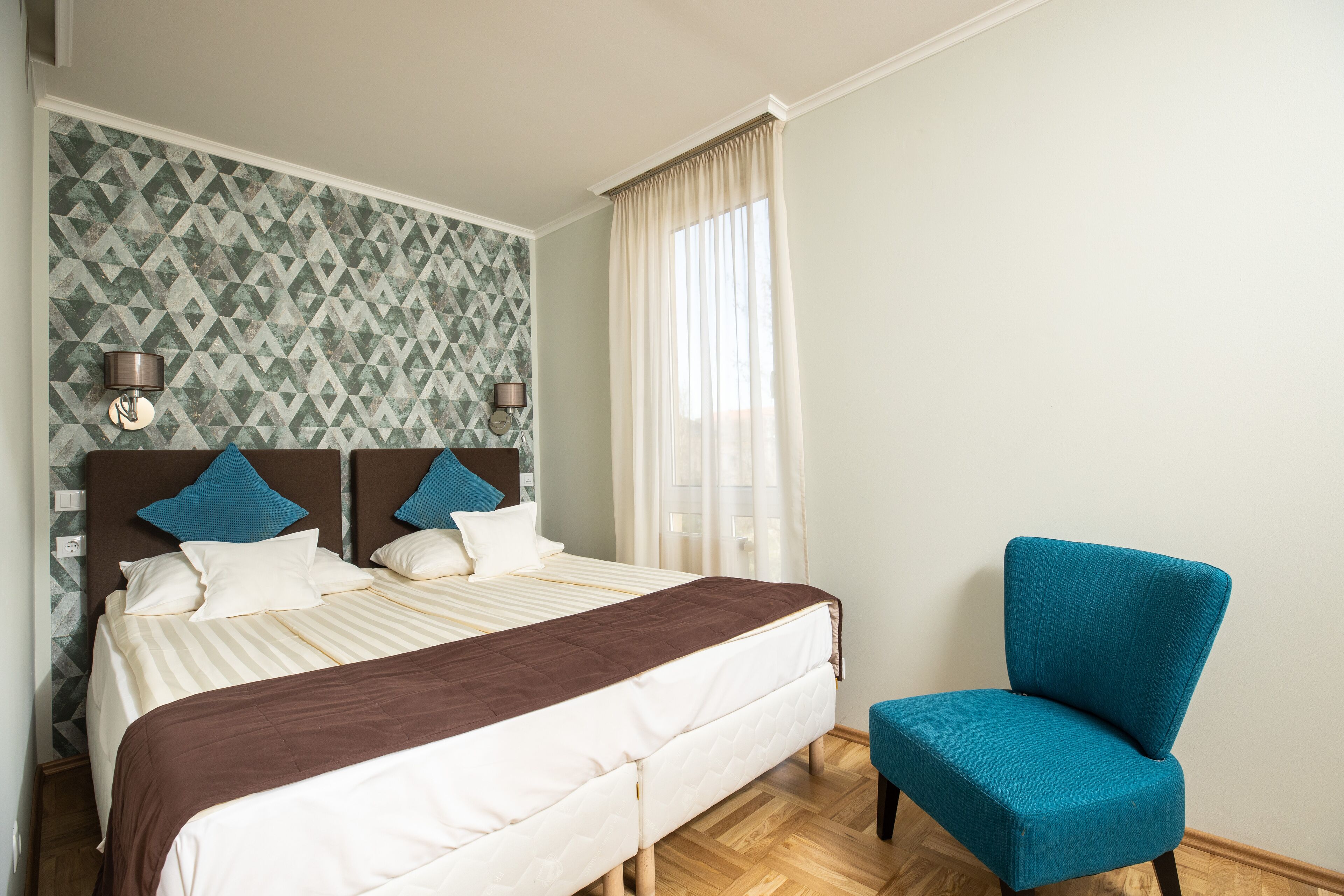 double or twin room | minibar, desk, blackout curtains, iron/ironing board