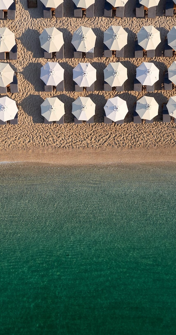 On the beach, sun-loungers, beach umbrellas, scuba diving