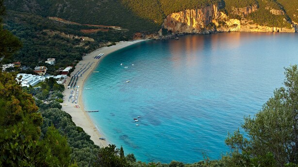 A coastal view with a beach, boats, and a cliff. - Lichnos Beach Hotel & Suites (Parga)