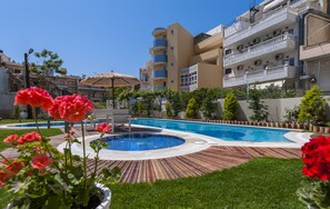 Seasonal outdoor pool, pool umbrellas, sun loungers