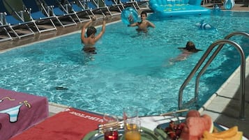 Seasonal outdoor pool, pool loungers