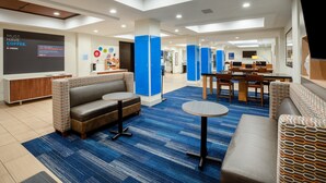 A modern hotel lobby with seating areas, a coffee station, and a reception desk. - Holiday Inn Express & Suites Rockport - Bay View by IHG (Rockport)