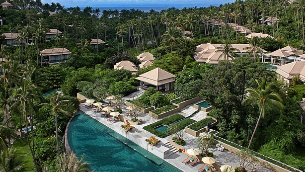 A resort with a large pool, multiple lounge areas, and a lush tropical setting. - Banyan Tree Samui (Koh Samui)