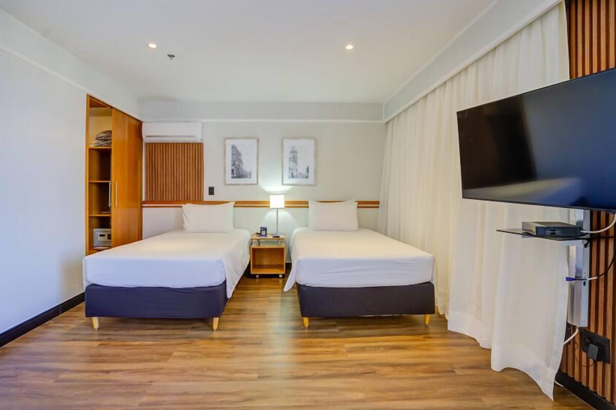Double or Twin Room | Minibar, in-room safe, desk, blackout drapes