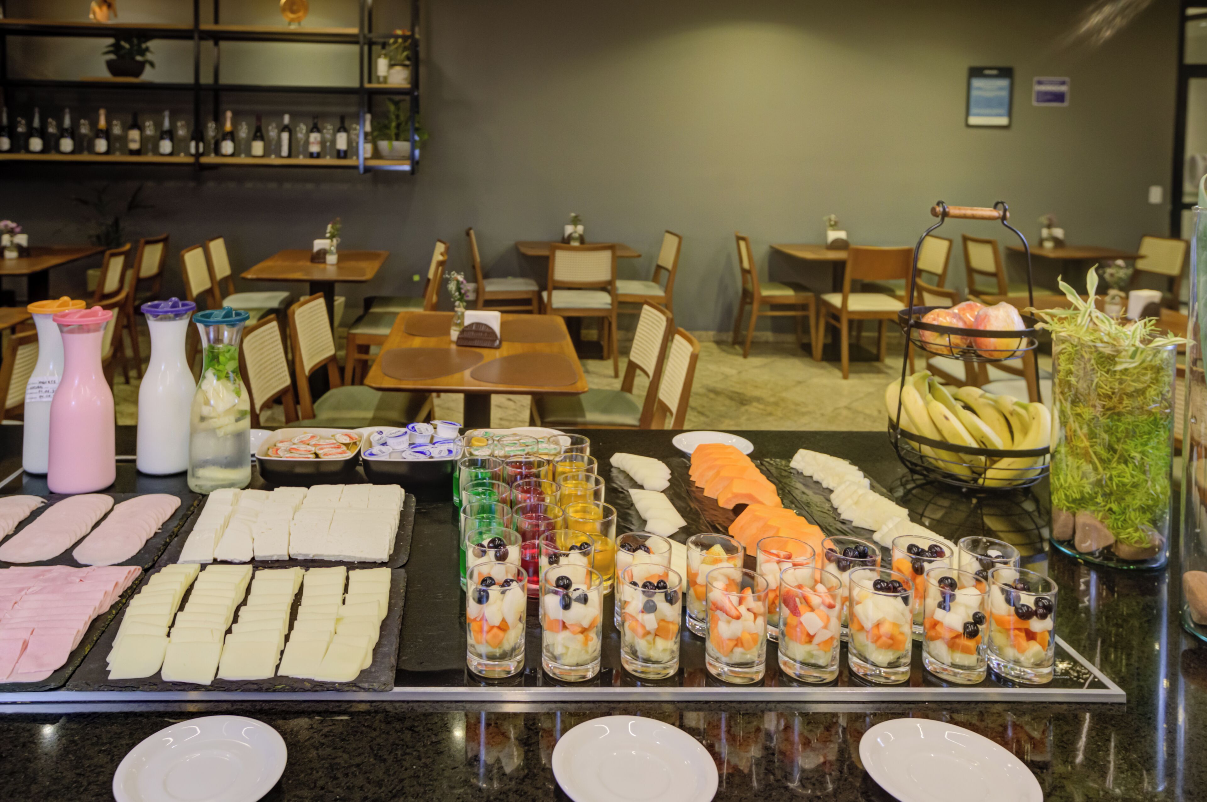 A buffet with various food items and beverages.