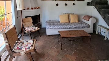 Master suite | Living area | TV, fireplace