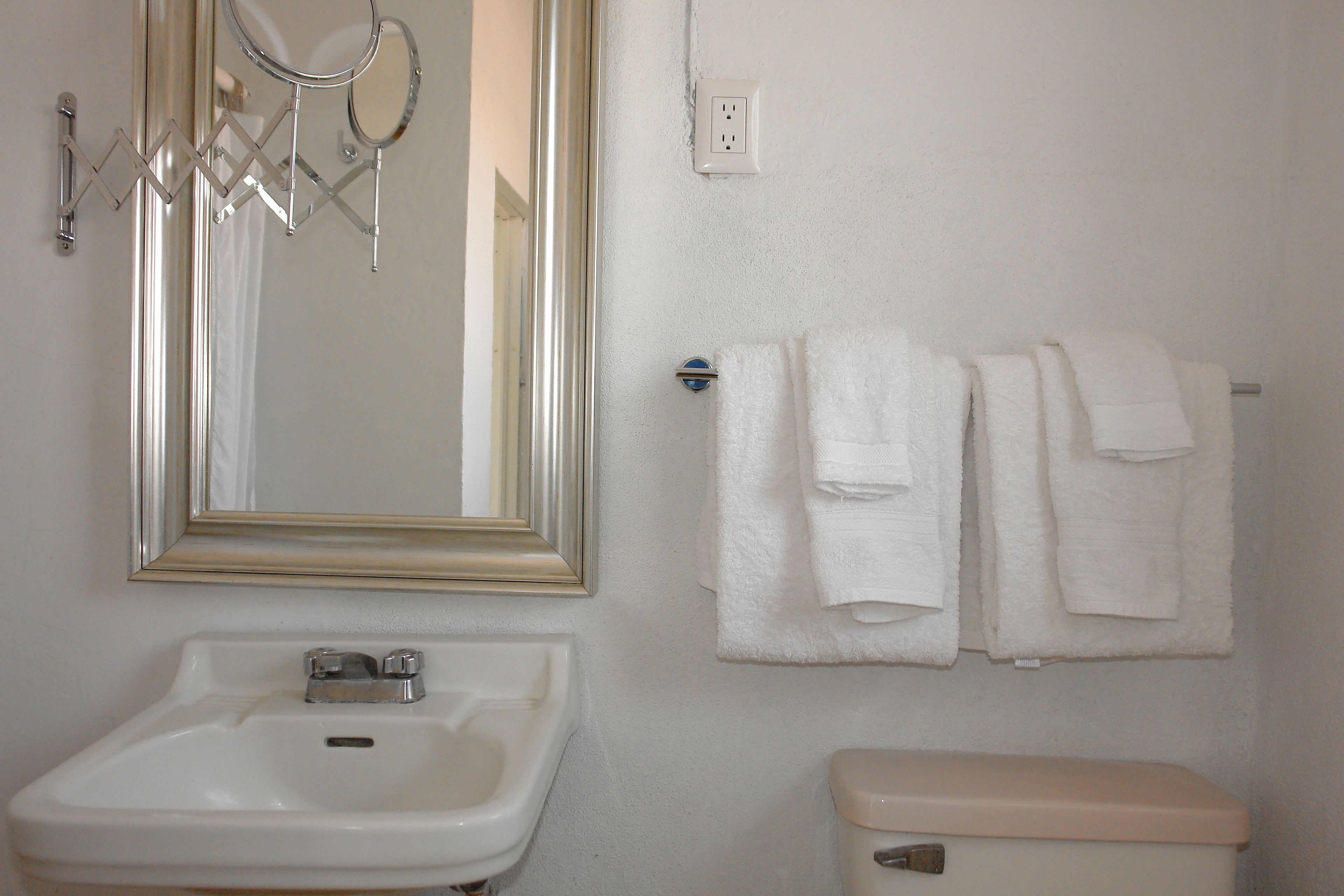 luxury suite, 1 queen bed | bathroom | free toiletries, hair dryer, towels