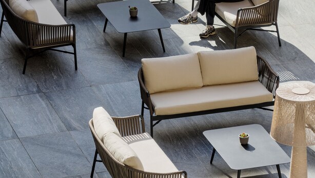 An outdoor seating area with sofas, chairs, and tables. - Hotel Giacomo Morra Alba - Handwritten Collection (Alba)