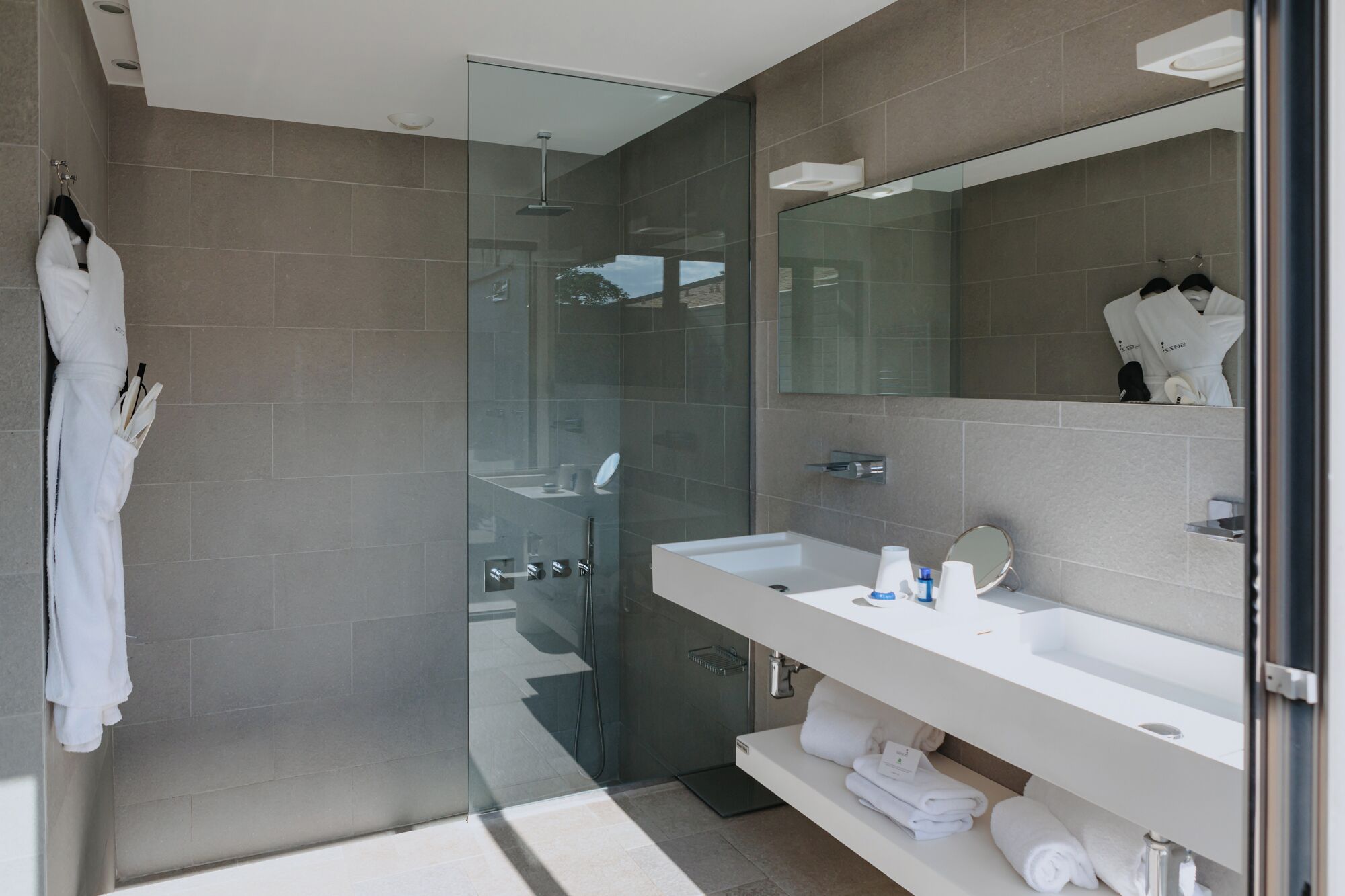 designer toiletries, hair dryer, bathrobes, slippers