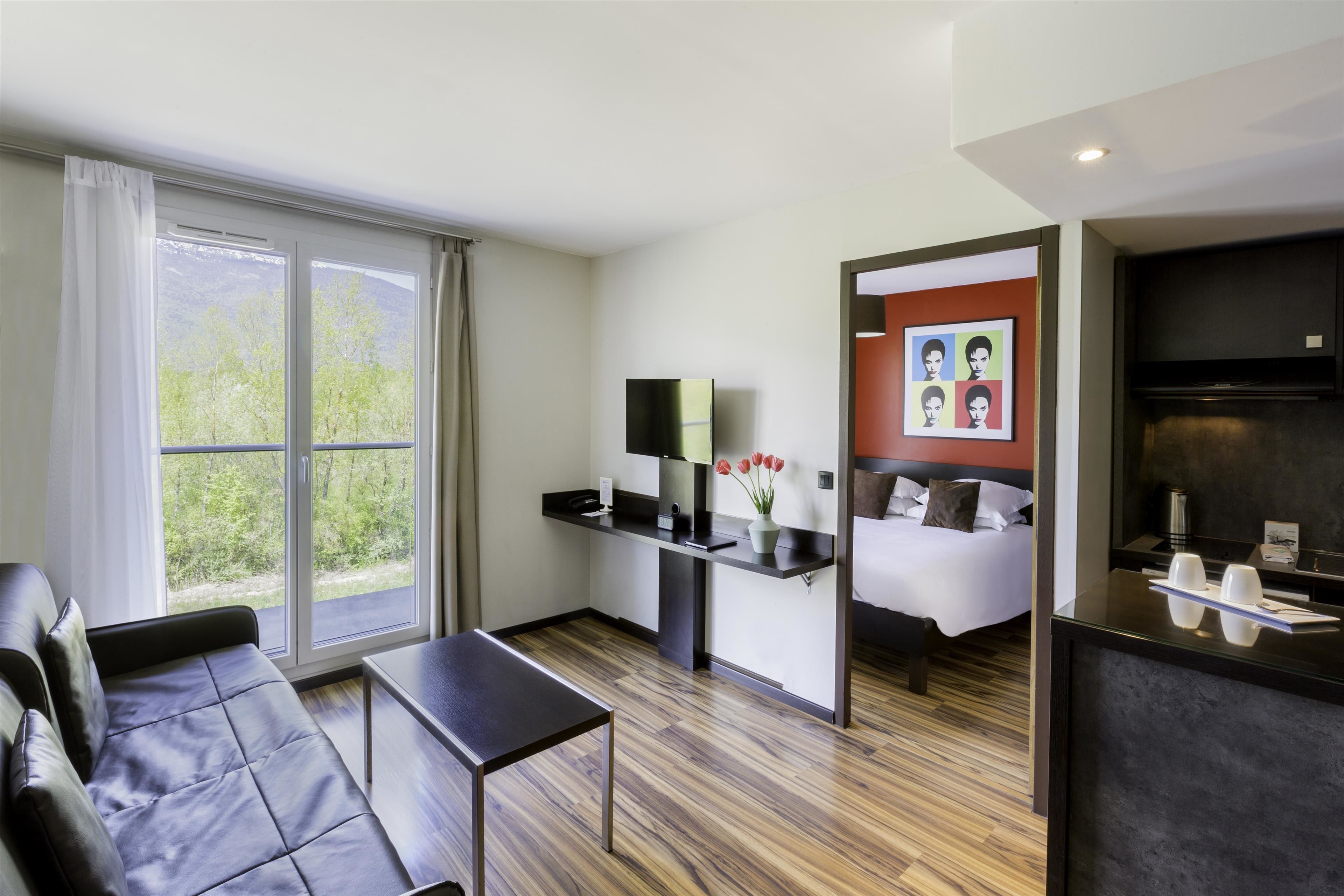 superior room, 1 queen bed, kitchenette (larger room;with sofabed) | in-room safe, desk, laptop workspace, blackout curtains