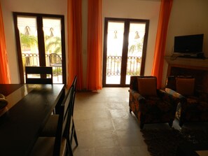 Apartment, 3 Bedrooms | Living room | 32-inch flat-screen TV with cable channels, TV