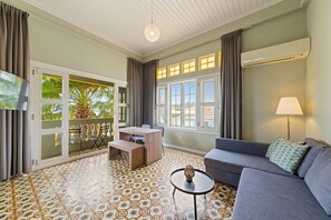 Apartment, 1 Bedroom, City View | Premium bedding, in-room safe, desk, iron/ironing board