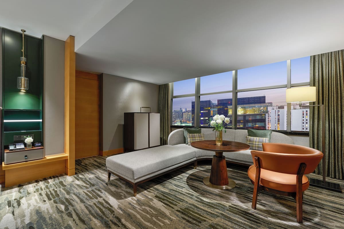 1 Bedroom Junior Suite | Living area | 42-inch LCD TV with cable channels, TV, iPod dock