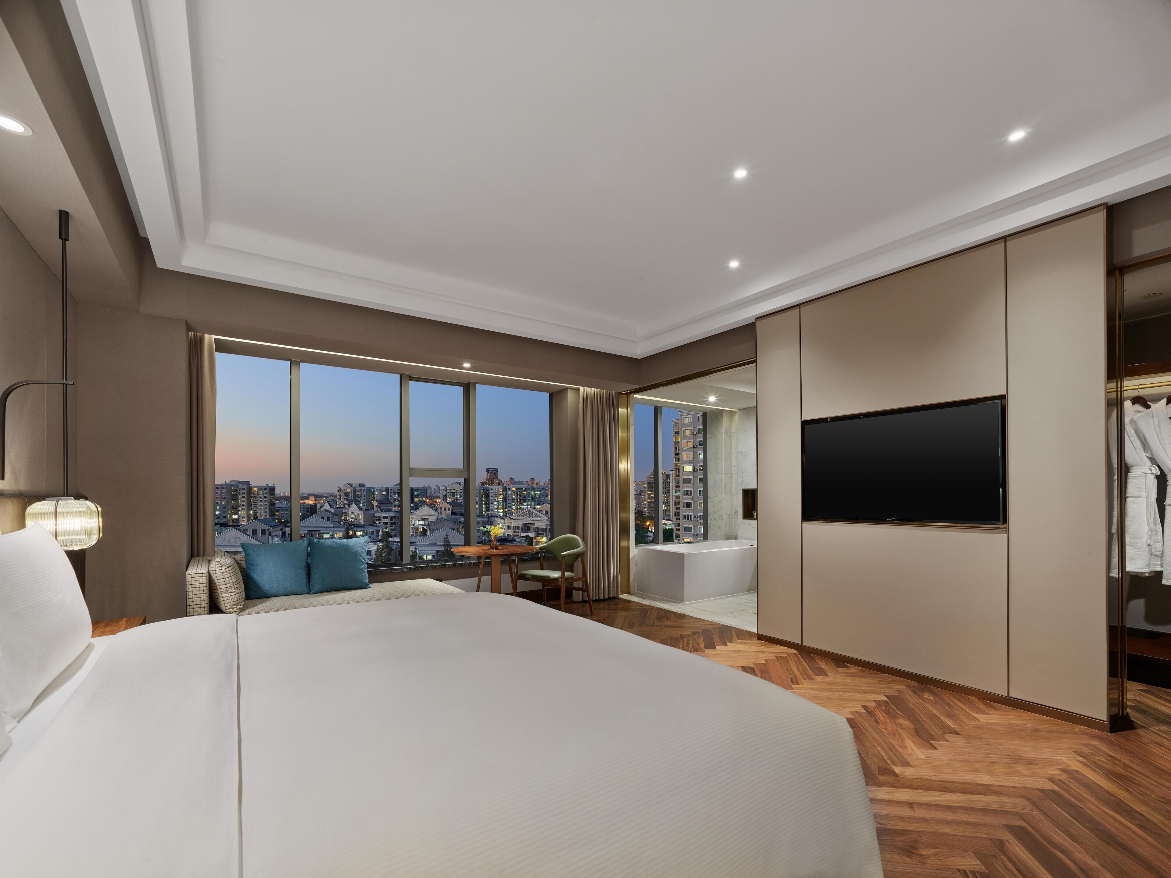 Premier Room, 1 King Bed | Bathroom | Separate tub and shower, rainfall showerhead, designer toiletries