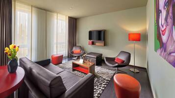 Junior Suite, 1 King Bed, Non Smoking | Living area | 43-inch LCD TV with cable channels, TV, pay films