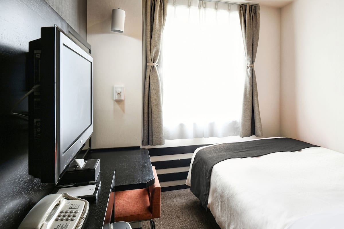 Down duvets, desk, laptop workspace, blackout curtains