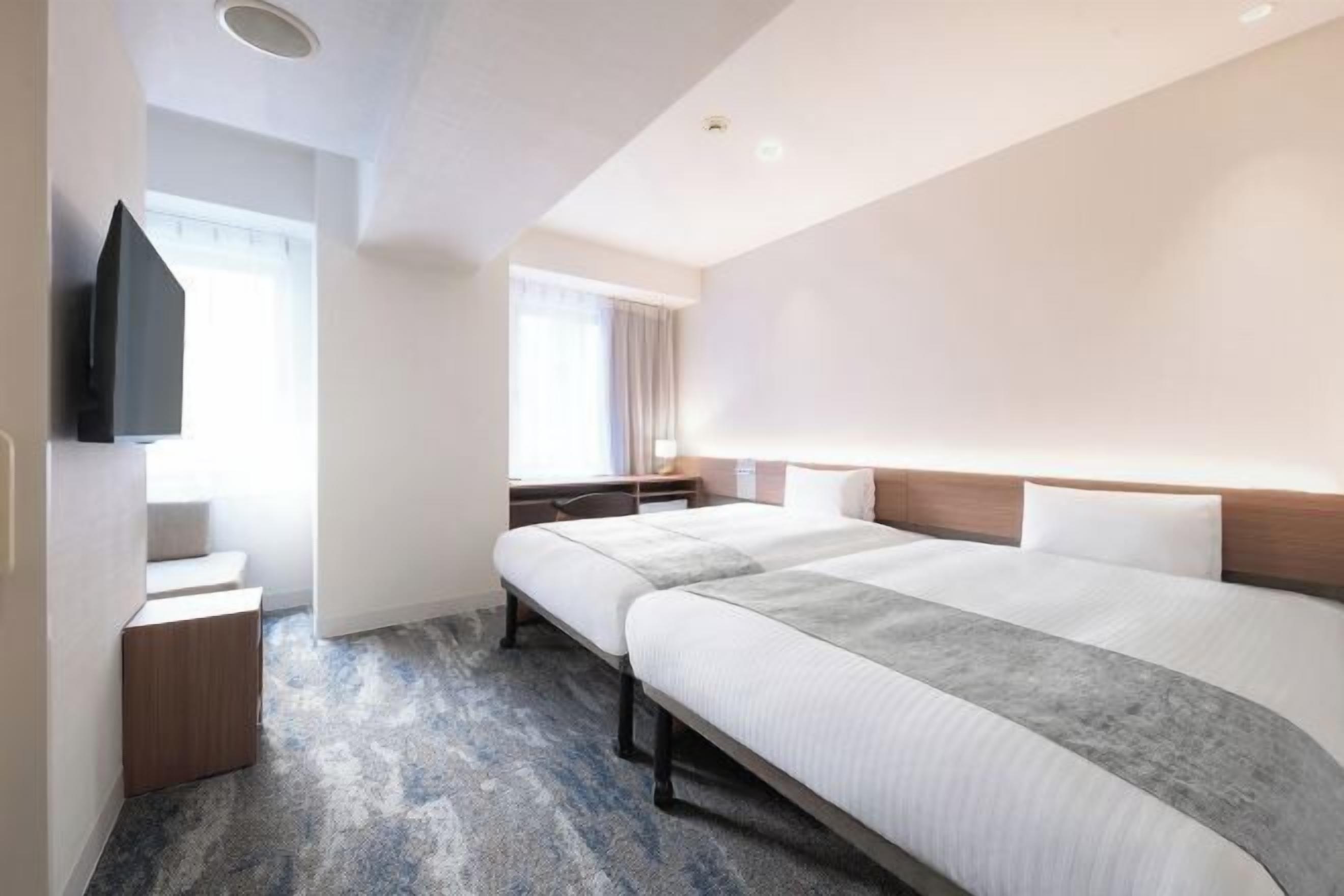 Down duvets, desk, laptop workspace, blackout curtains