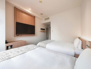 Down duvets, desk, laptop workspace, blackout curtains