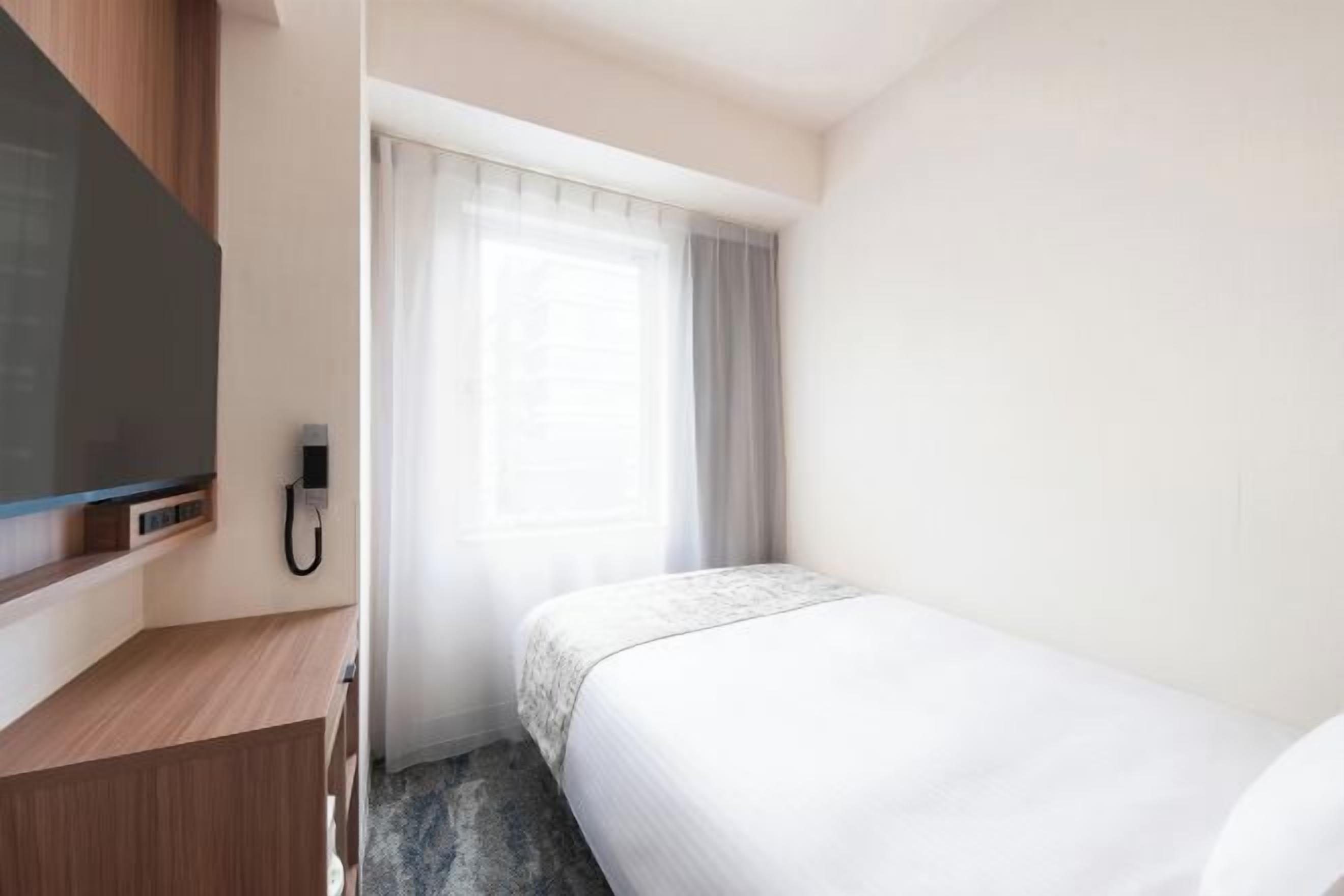 Down comforters, desk, laptop workspace, blackout drapes